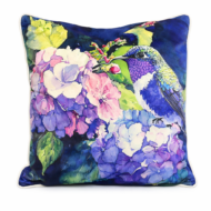 Deep blue scatter cushion with watercolor hydrangea blooms in lilac and pink, accented by a graceful hummingbird