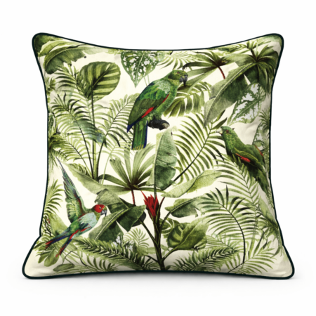 Cream scatter cushion with lush jungle foliage print featuring vibrant green and red parrots among palm leaves