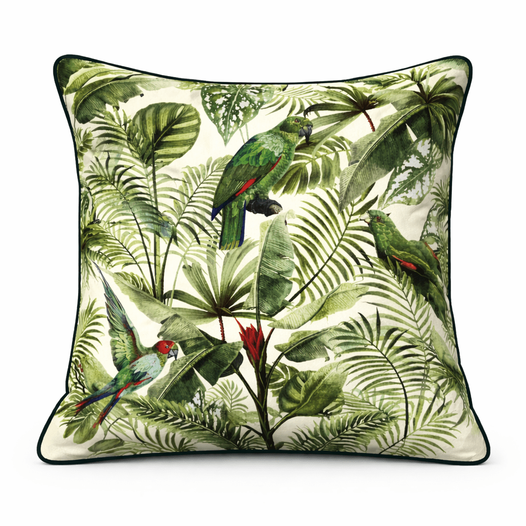 Cream scatter cushion with lush jungle foliage print featuring vibrant green and red parrots among palm leaves