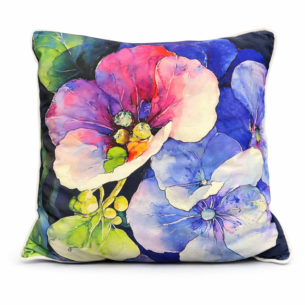 Watercolor floral scatter cushion with large blooms in blush pink, violet, and blue tones against a dark background