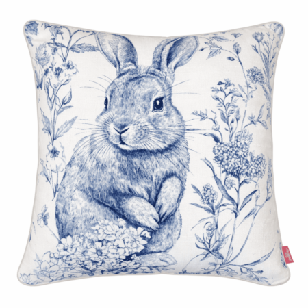 Blue and white illustrated bunny scatter cushion surrounded by delicate botanical florals