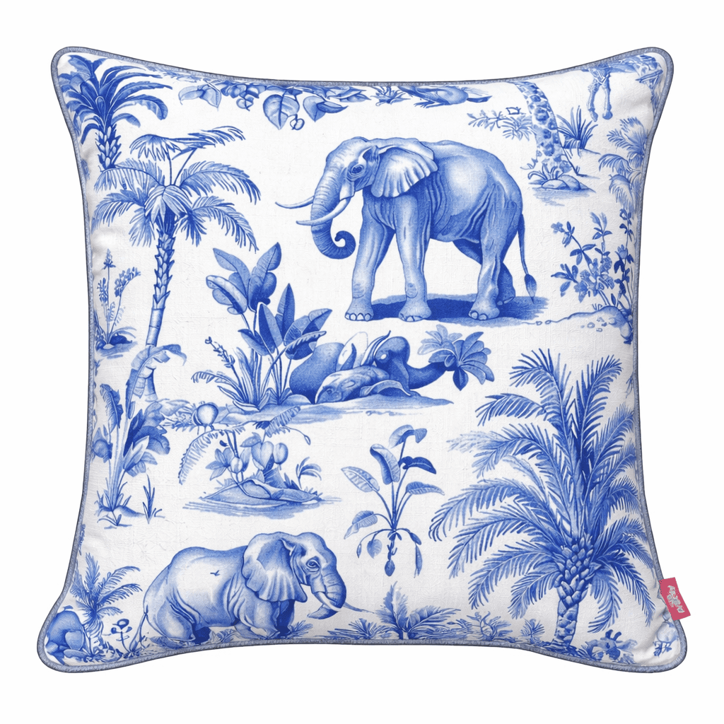 Blue and white chinoiserie-style scatter cushion featuring elephants among palm trees and botanical illustrations