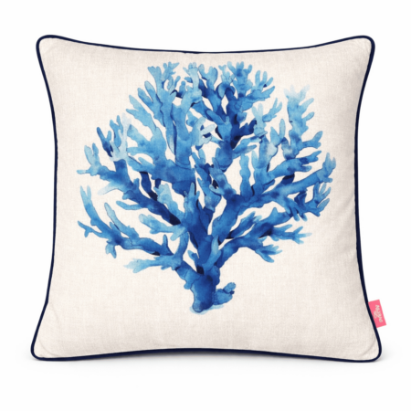 White scatter cushion with blue watercolor coral illustration and navy piping