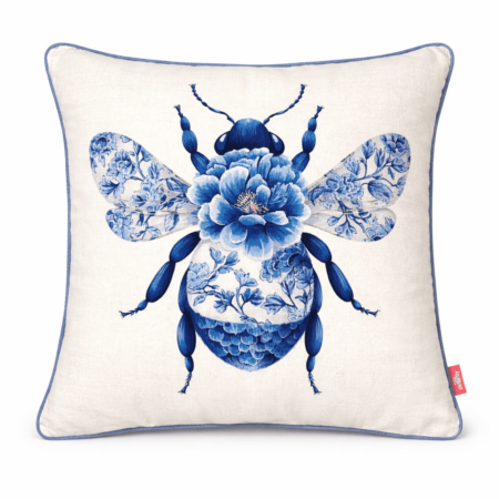 Ivory scatter cushion featuring a blue bumblebee illustration with a floral peony body and patterned wings