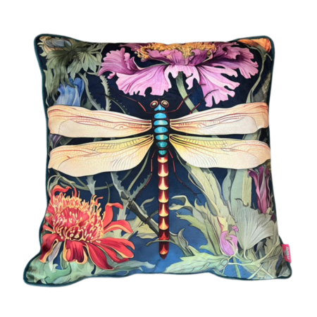 Bold scatter cushion with large dragonfly illustration in mauve and jewel tones against a moody floral background