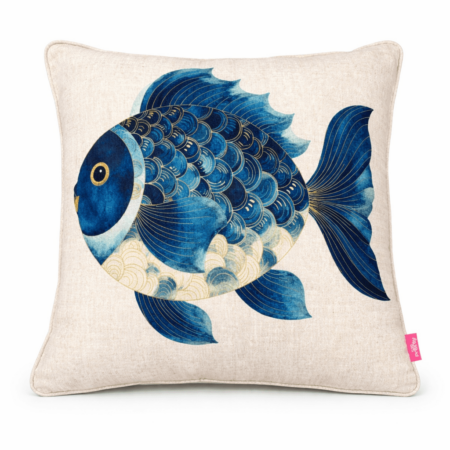 Neutral scatter cushion featuring a round illustrated blue fish with gold-accented scales