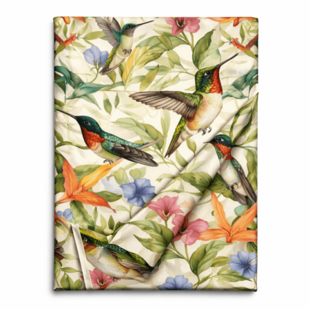 Ivory table runner with watercolor hummingbird and tropical floral print, folded to show fabric drape