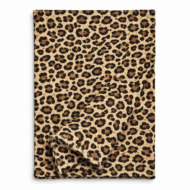 Leopard print table runner in warm neutral tones, folded to show fabric texture