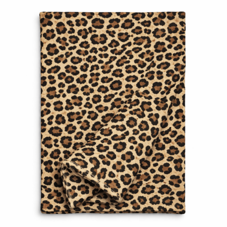 Leopard print table runner in warm neutral tones, folded to show fabric texture
