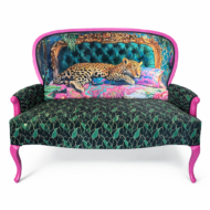 Upcycled settee with teal tufted leopard print backrest, green leaf print seat, and pink legs.