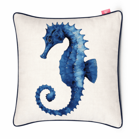 Ivory scatter cushion with detailed blue watercolor seahorse illustration and navy piping