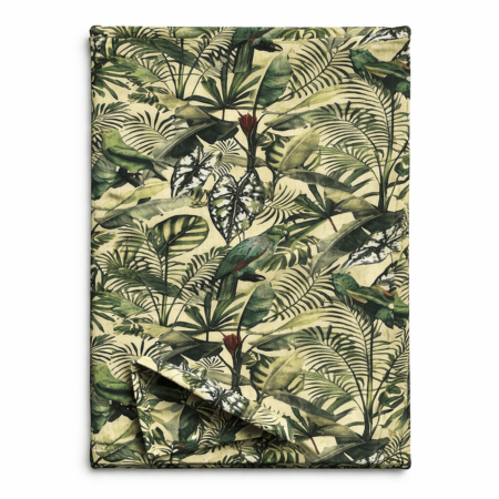 Tropical leaf print table runner with exotic birds hidden among layered green foliage, folded to show fabric texture