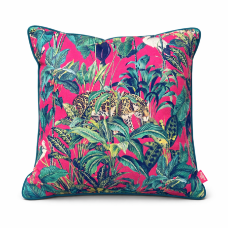 Vivid cherise pink scatter cushion with a jungle print featuring a leopard moving through tropical foliage