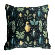Black throw pillow with symmetrical beetle and botanical print design.