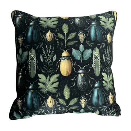 Black throw pillow with symmetrical beetle and botanical print design.