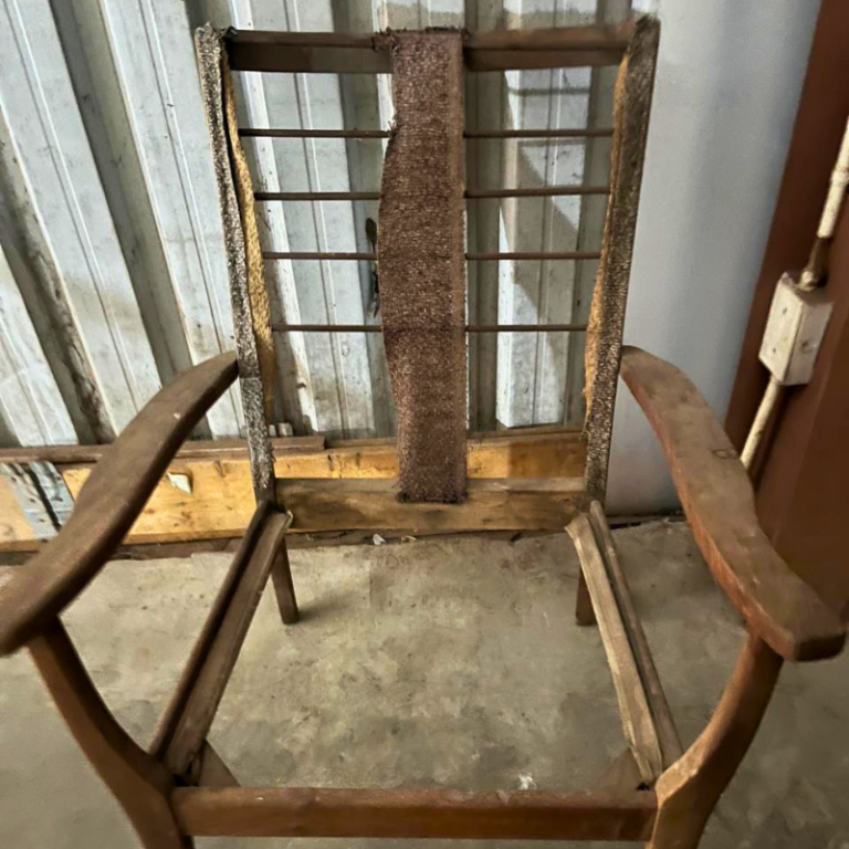 Bare wooden chair frame ready for restoration and reupholstery.